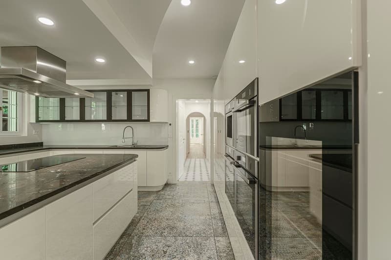 modern kitchen, granite countertops, under cabinet lighting, stainless steel appliances, white cabinets