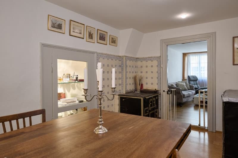 dining room, wooden table, candle holder, chairs, decorative items, hallway, living room, couch, chair, staircase