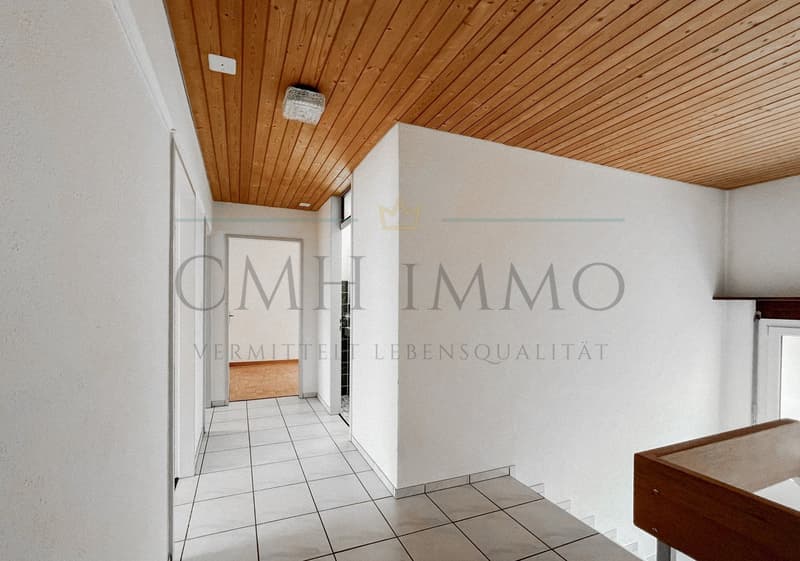 white walls, wooden ceiling, white tiles, white door, wooden floor