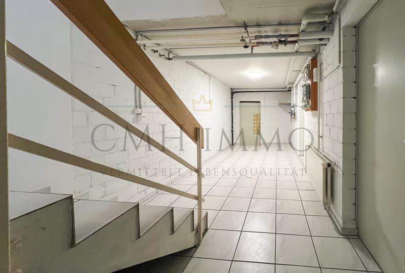 basement of house with staircase, white brick wall, white tile floor, pipes on ceiling
