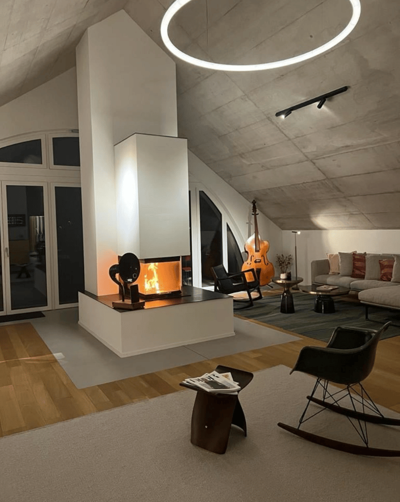 wooden floor, modern design, central fireplace, glass doors, rocking chair, carpet, table, decorative objects