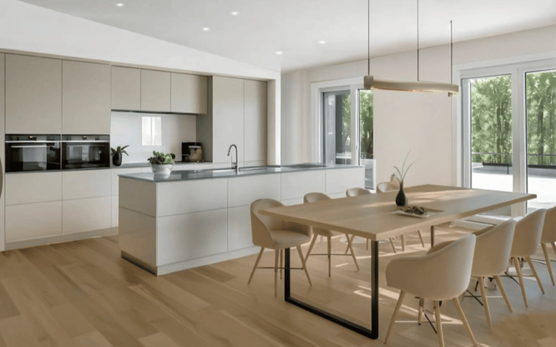 contemporary open plan kitchen, large wooden dining table, integrated appliances, large sliding windows