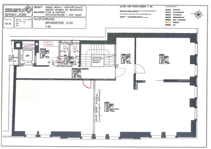 Floor plan of a residential and commercial building with specific room designations, measurements, and construction materials indicated.
