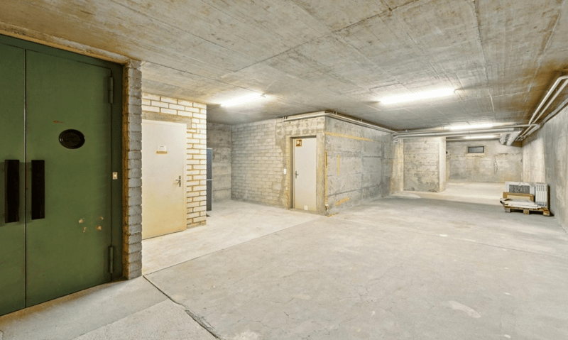 underground parking with two entrances and an electrical installation room