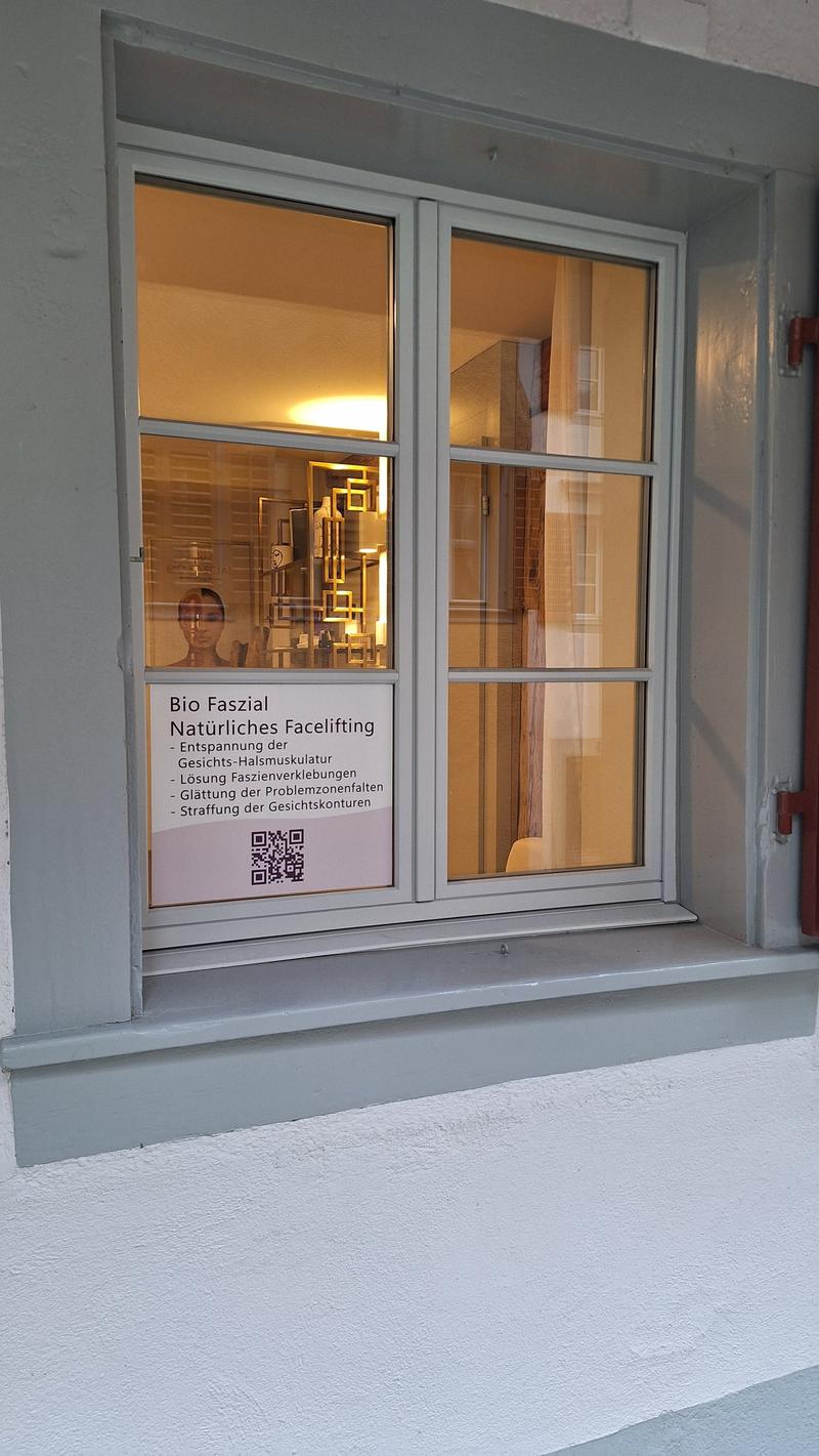 Gray double window, advertisement poster on the window