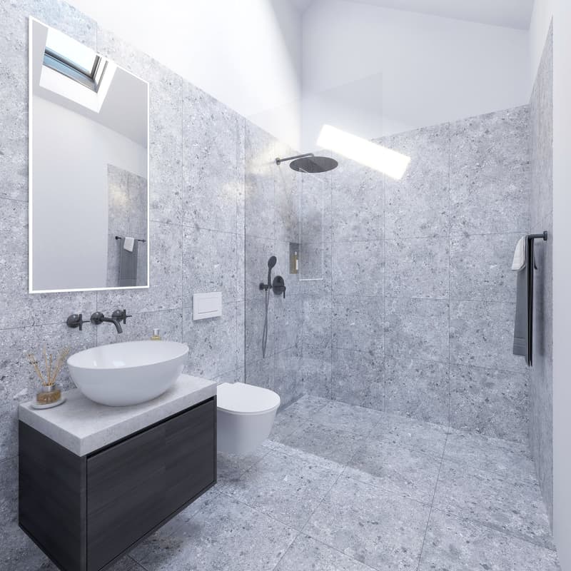modern bathroom with gray tiles, white sink, black faucet, white toilet, glass shower enclosure, mirror, and towel rack