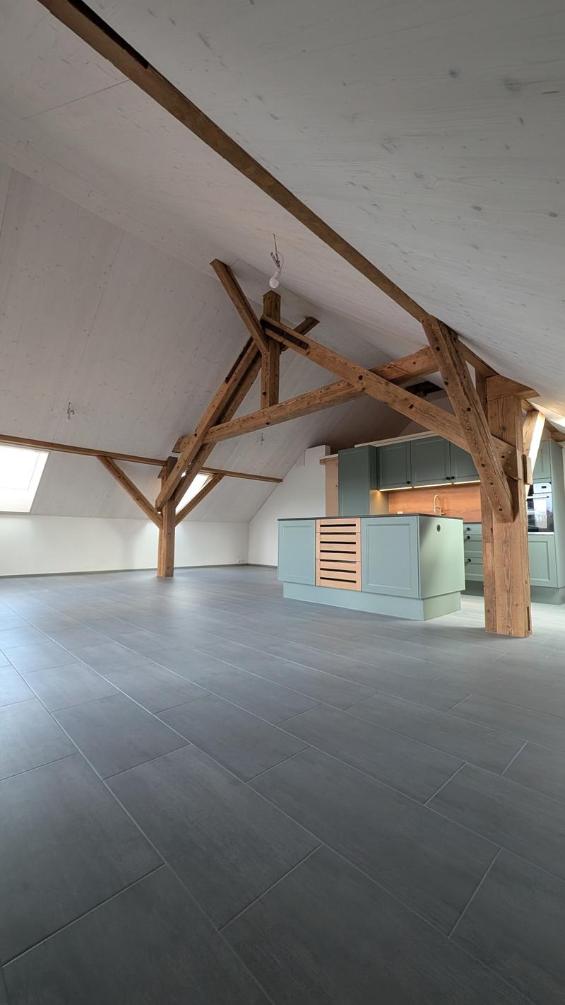 empty room, wooden beams, tiled floor, kitchen island, cabinets, sink, oven
