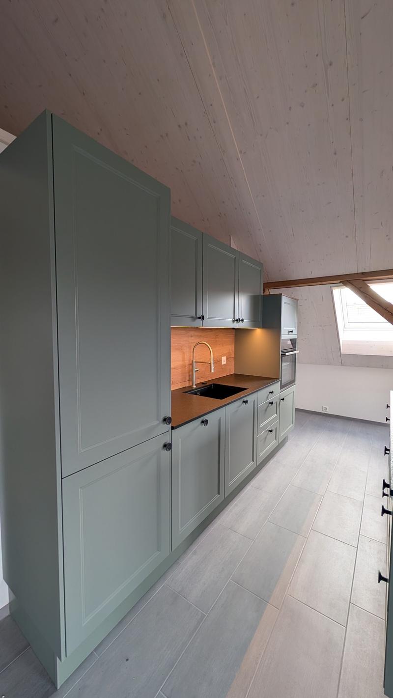 modern kitchen with wooden ceiling, gray cabinets, wooden countertop, stainless steel sink, faucet, oven, tiled floor