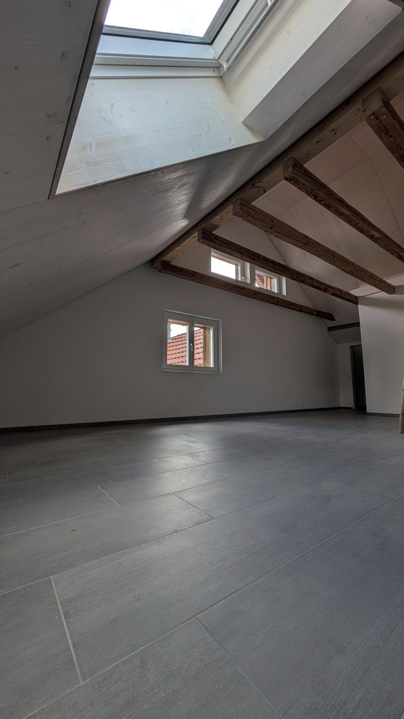 empty room, wooden beams, tiled floor, windows