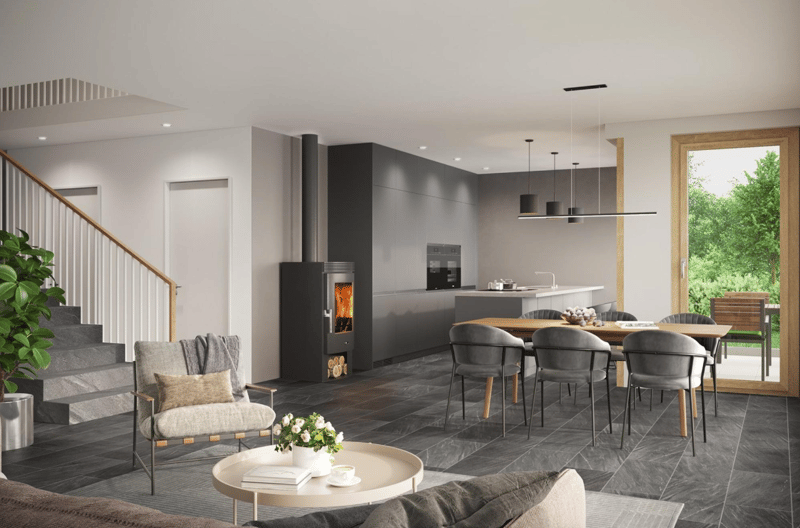 Open-plan living and dining area with modern furniture, fireplace, and kitchen. Large windows and sliding doors.