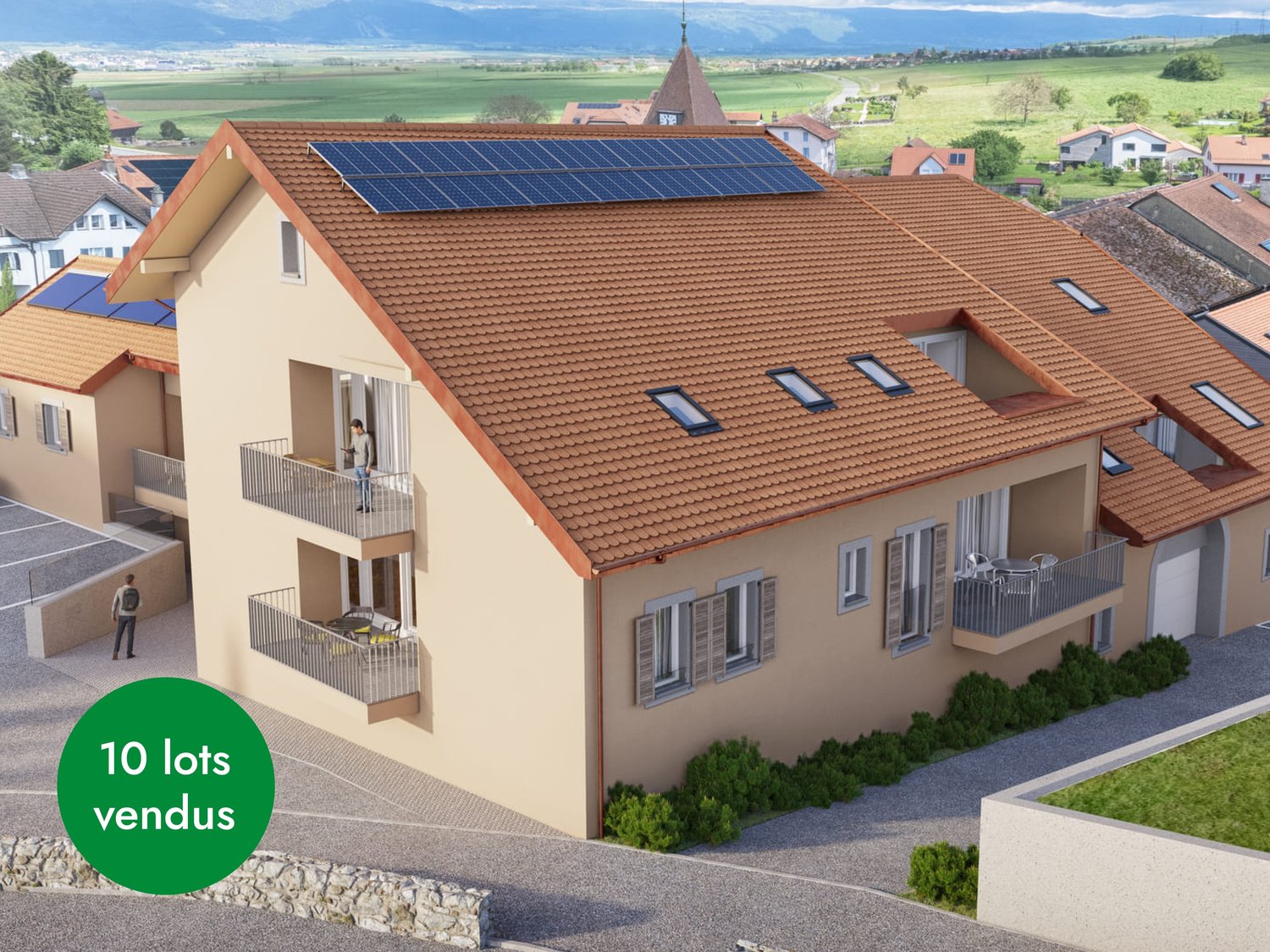3-story apartment building with orange tile roof, solar panels installed on the roof, balconies on each apartment, surrounded by greenery and with a view of the countryside in the background
