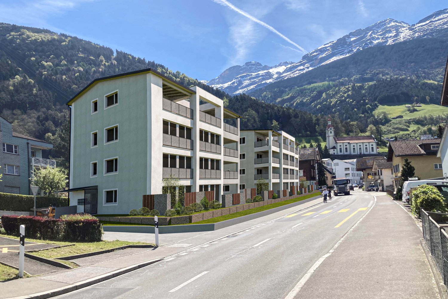 New apartment complex with balconies, surrounded by greenery, mountains in the background