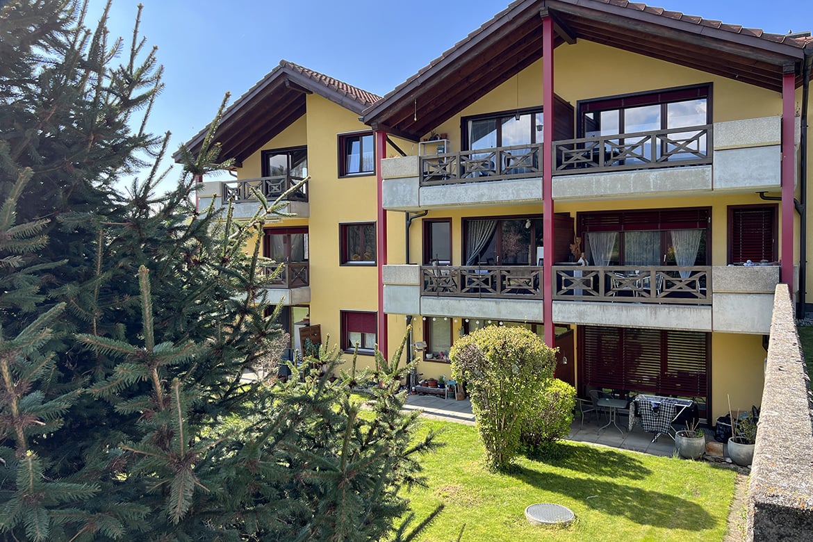 3 story apartment, yellow, 3 balconies
