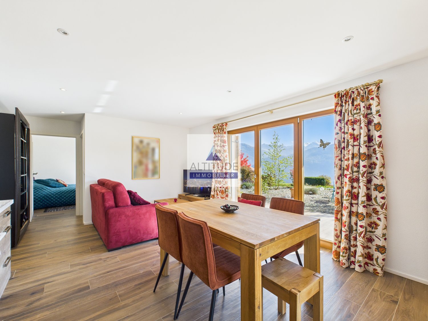 wooden dining table, velvet chairs, large windows, red sofa, television, hallway, bedroom