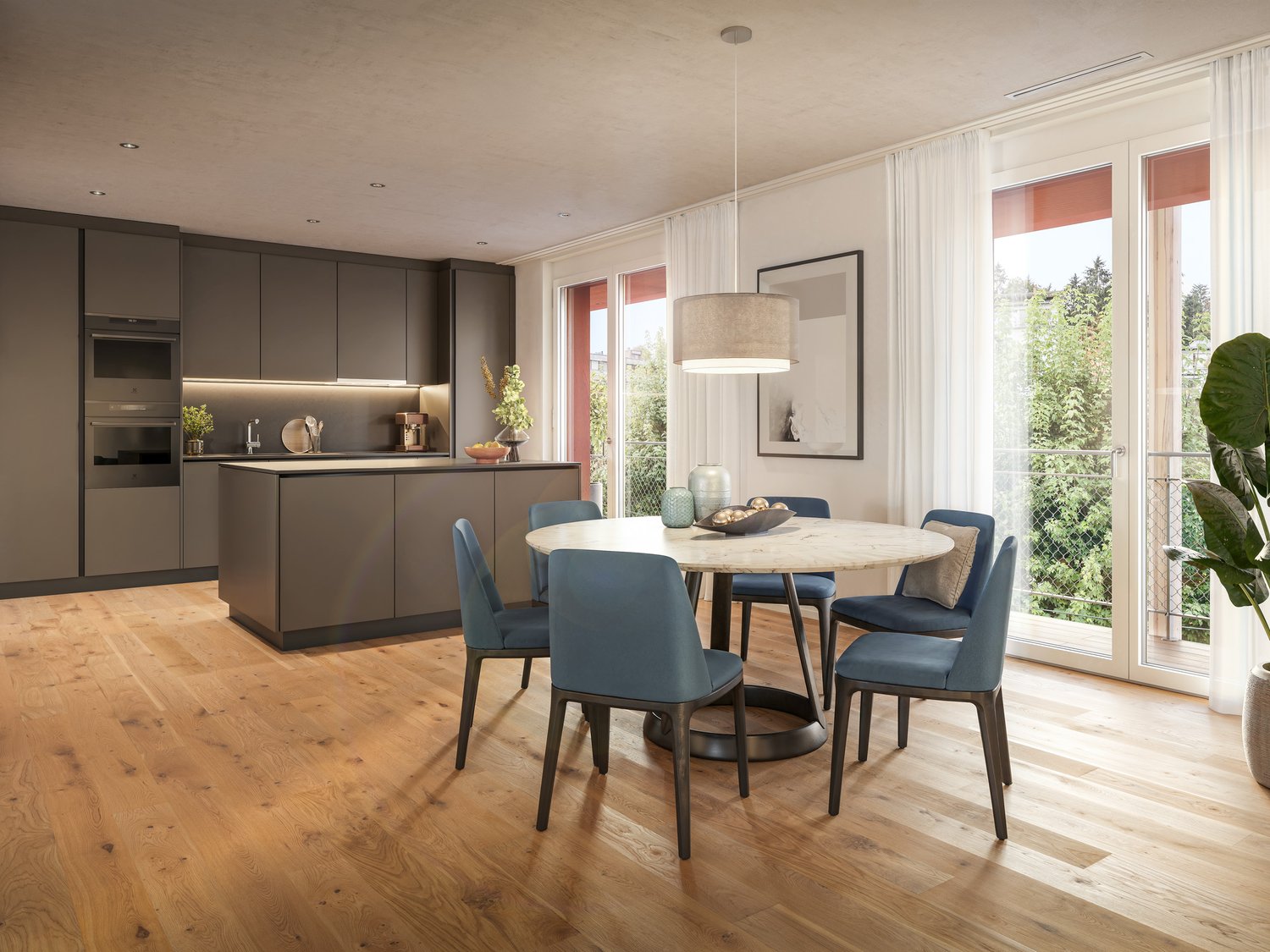 The image shows a modern and open-concept kitchen and dining area. The kitchen features dark gray cabinets and a sleek, minimalist design. The dining area has a round wooden table with blue upholstered chairs. Large windows provide ample natural light and