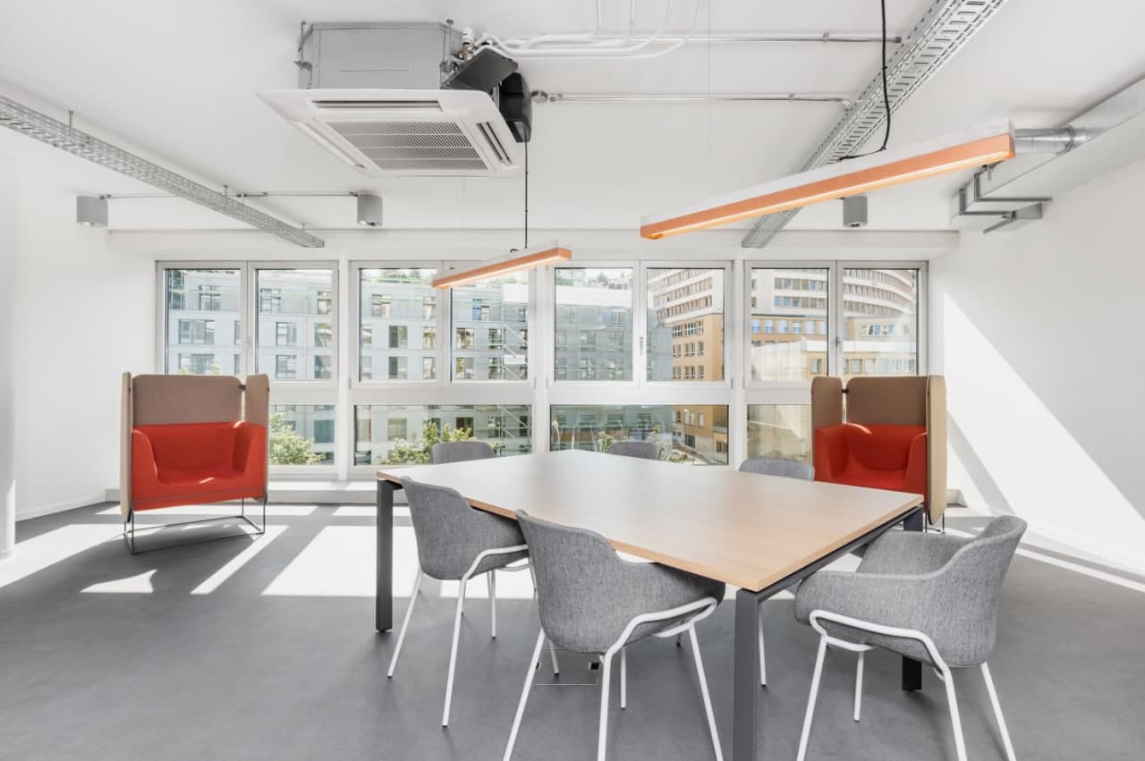 modern office room, long table, chairs, large windows, air conditioning