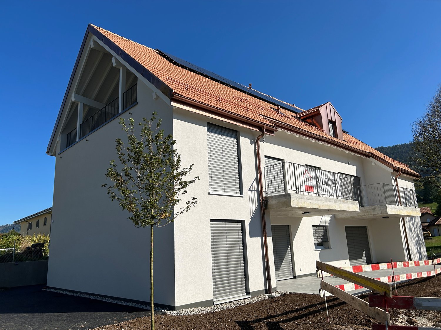 modern house, red roof, white walls, solar panels, balconies, garages