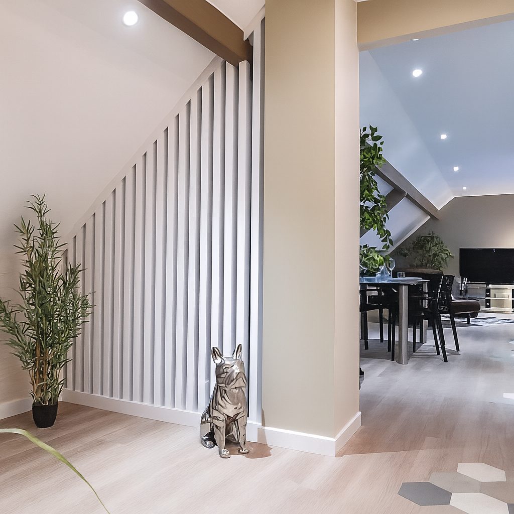modern apartment, white walls, wooden flooring, glass table, plants, silver dog statue
