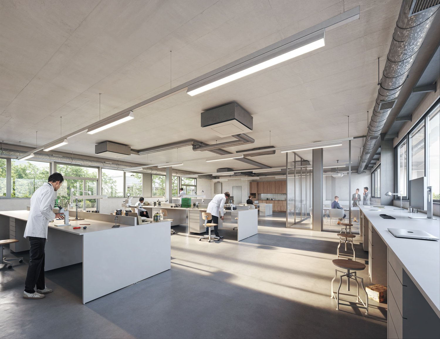 The image shows a modern, open-plan office space with a kitchen area. The space features large windows, allowing natural light to flood in. There are various workstations with desks and chairs, as well as a kitchen counter with what appears to be a dishwa