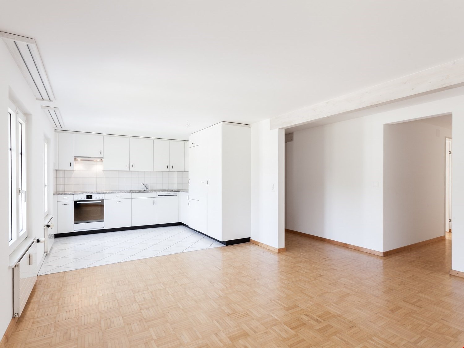 open kitchen, white cabinets, white floor, white walls, modern, empty