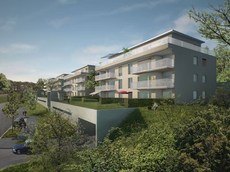 Multistory apartment building, with multiple balconies and windows, greenery, driveway and parking