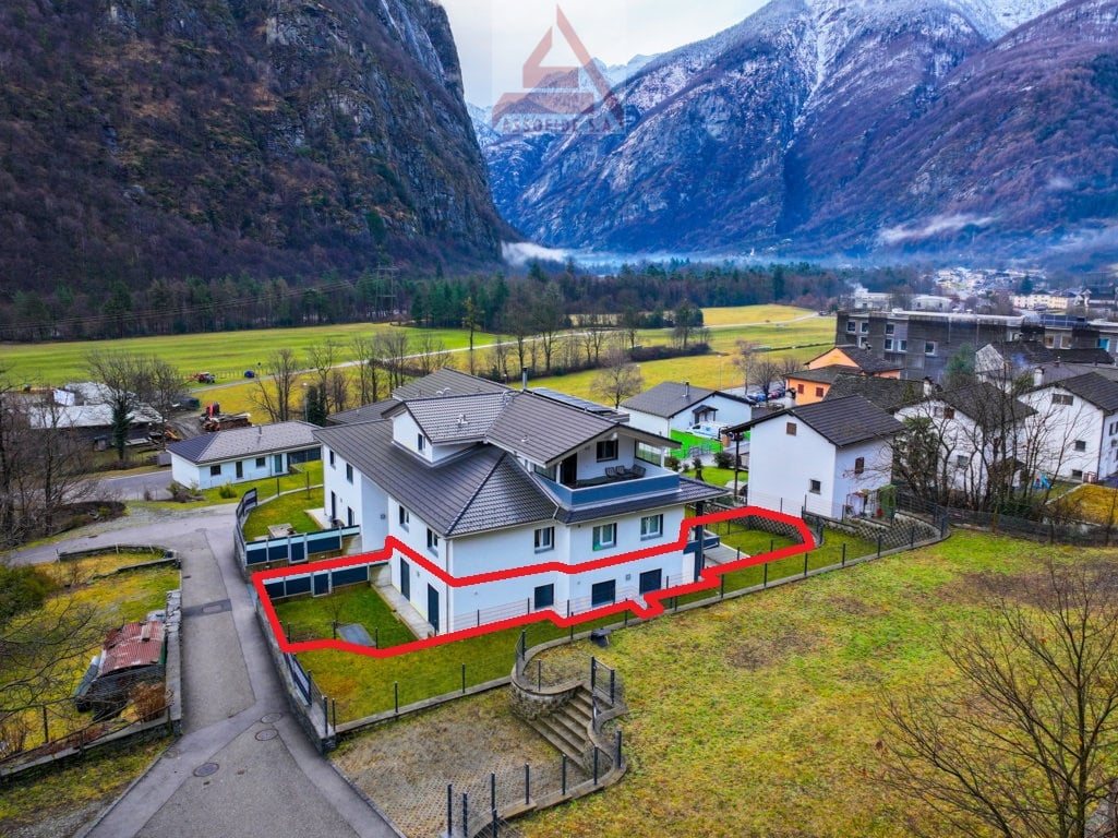modern single family house, 3 floors, gray roof, surrounded by mountain