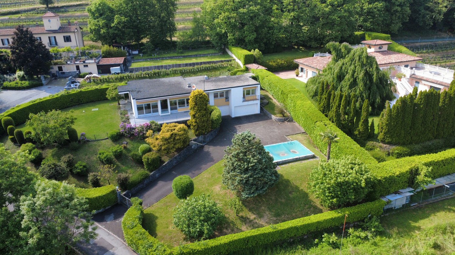 2 story house, white, pool, hedges, driveway