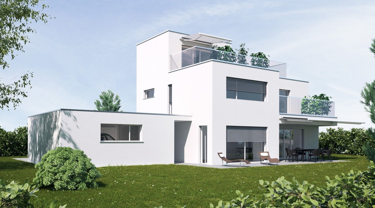 Two-story modern white house with a flat roof, large windows, and a balcony on the second floor. The house has a garage attached to the side. The property is surrounded by a well-manicured lawn and lush greenery.