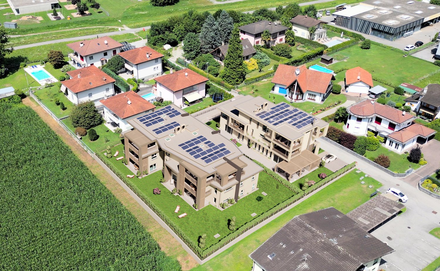 Apartment building with solar panels, swimming pool, green areas, separate houses in the background