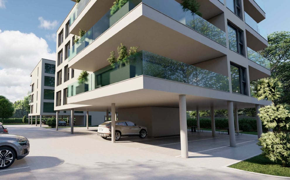 Modern apartment building with underground parking garage, glass balconies, open parking lot, and trees