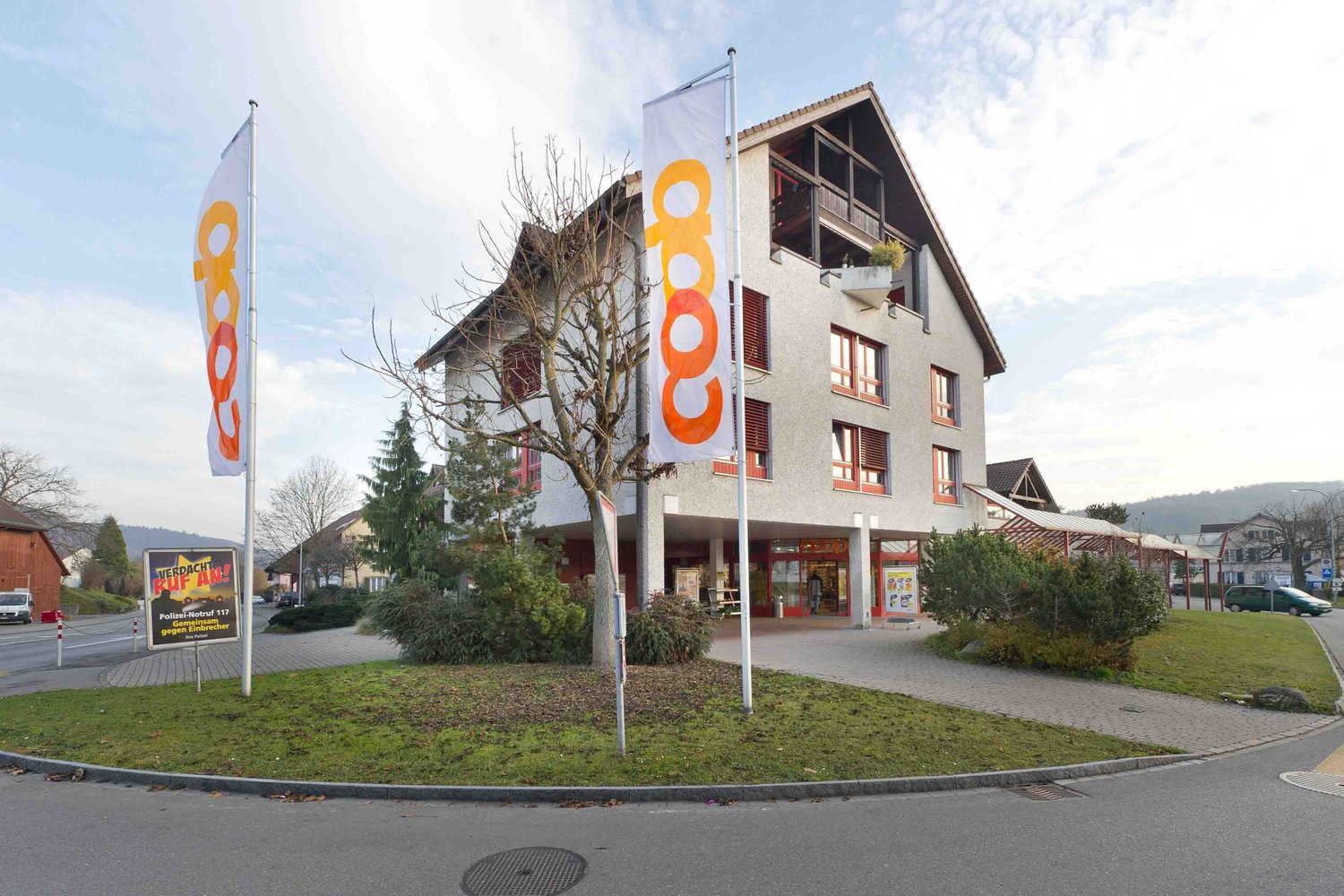 multistory building, balcony, sign, plants, building