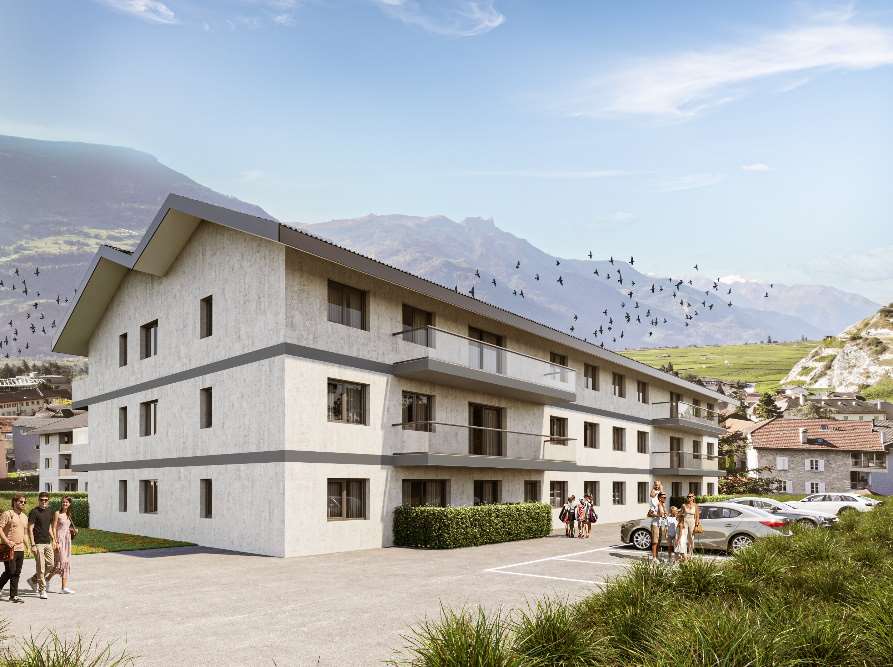 Modern three-story apartment building, with balconies, white exterior, landscaped area with shrubs, cars parked in front, people walking around, mountainous backdrop.