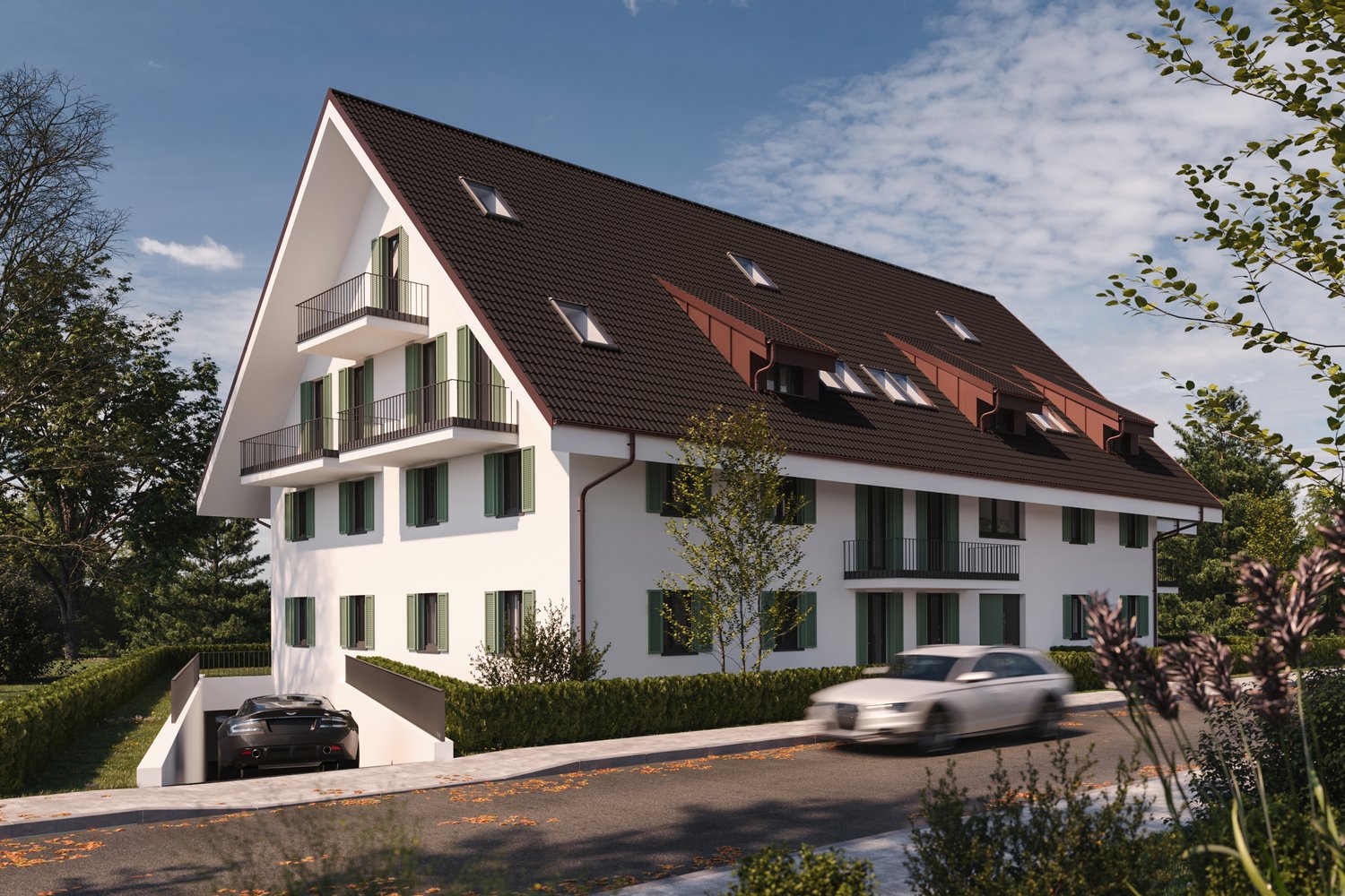A modern two-story white apartment building with a brown roof, balconies, and green shutters. There are two cars parked in the driveway and a car driving on the street in front of the house.