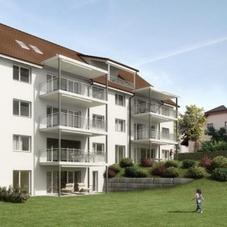 Multi-story building, balconies, brown roof, white walls, garden