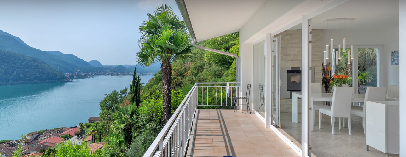 balcony with view of a lake and mountains