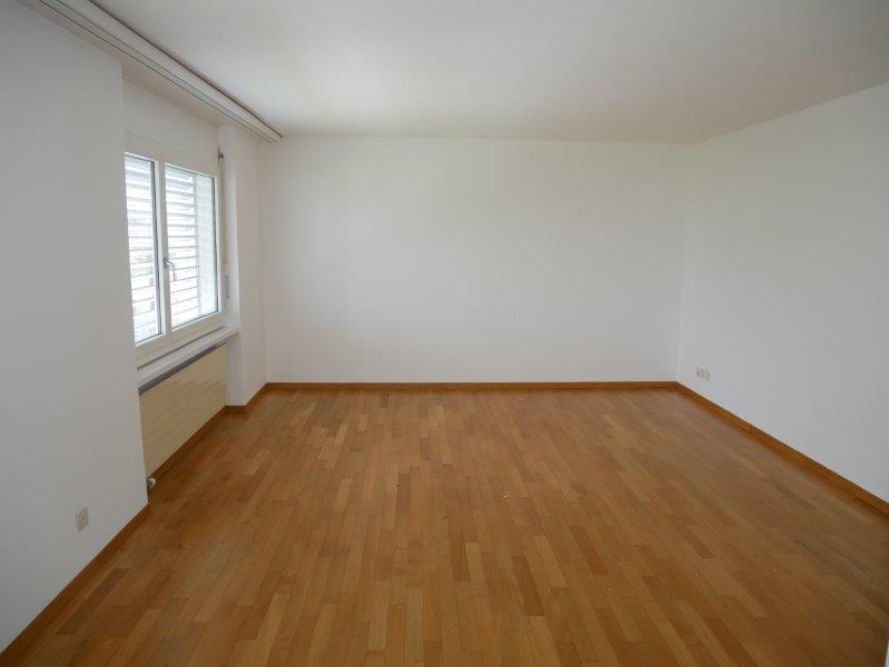 empty room, wooden floor, white walls, window with white shutters, outlet on wall