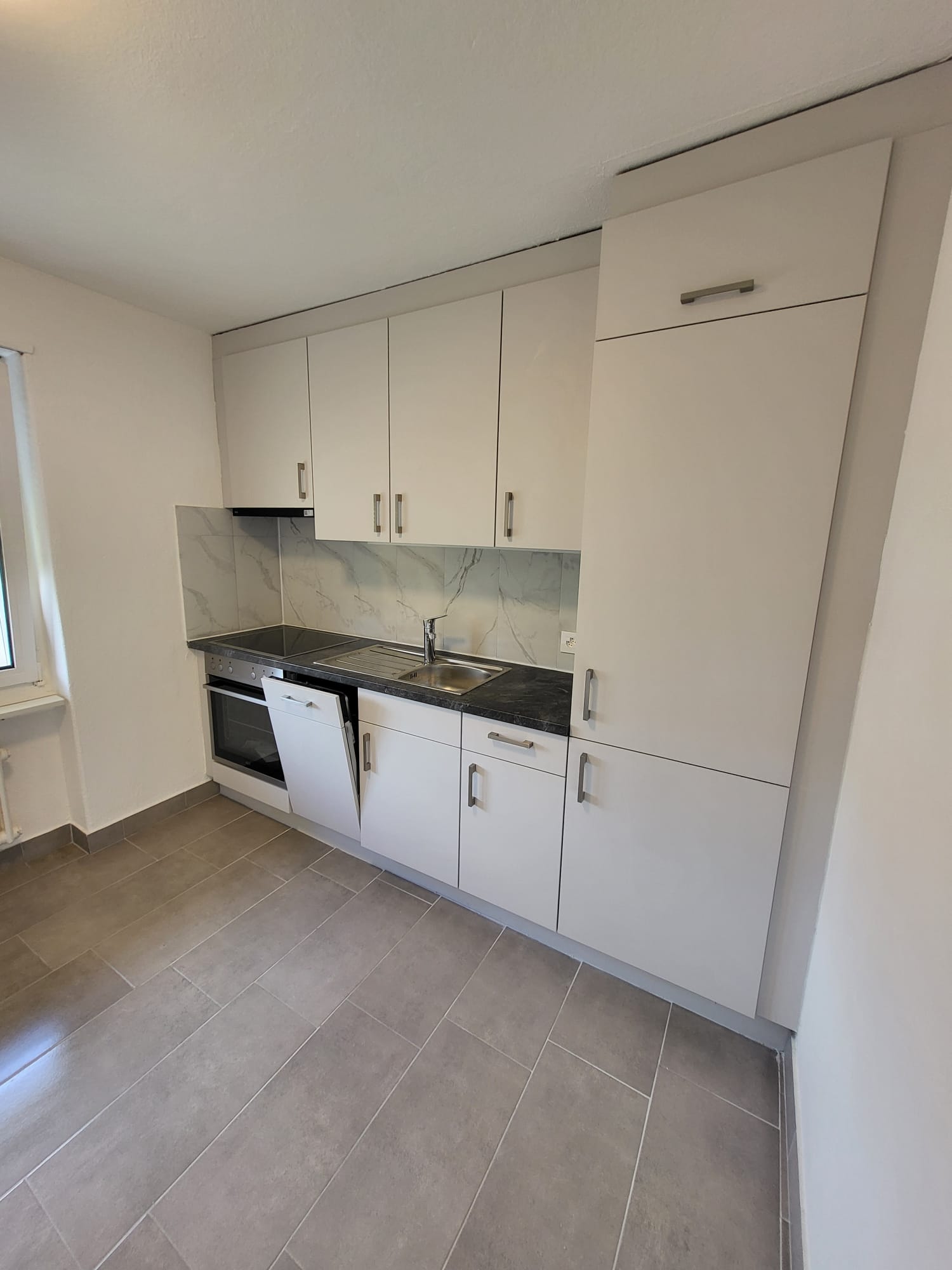 modern white kitchen, kitchen island, dishwasher, built-in oven, dishwasher, countertops, grey tiles