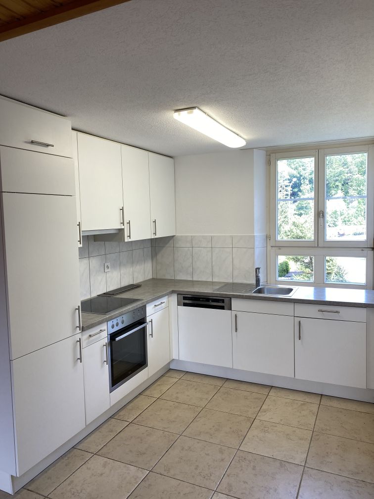 all white cabinets, granite counter top, modern appliances, including oven, stove, dishwasher, double sink