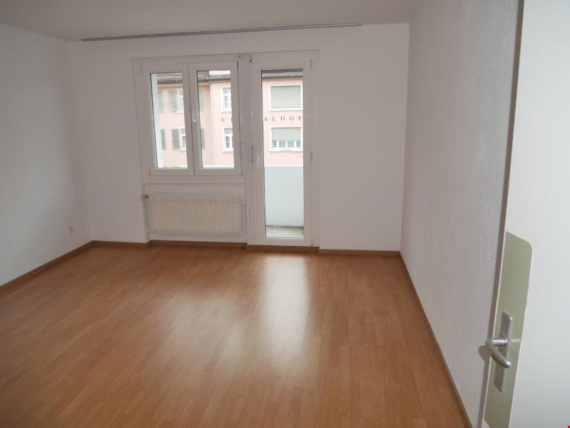 empty room, hardwood floors, large windows, balcony, white walls