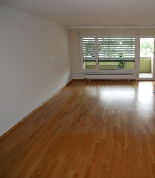 empty room, wooden floor, white walls, sliding glass doors, balcony