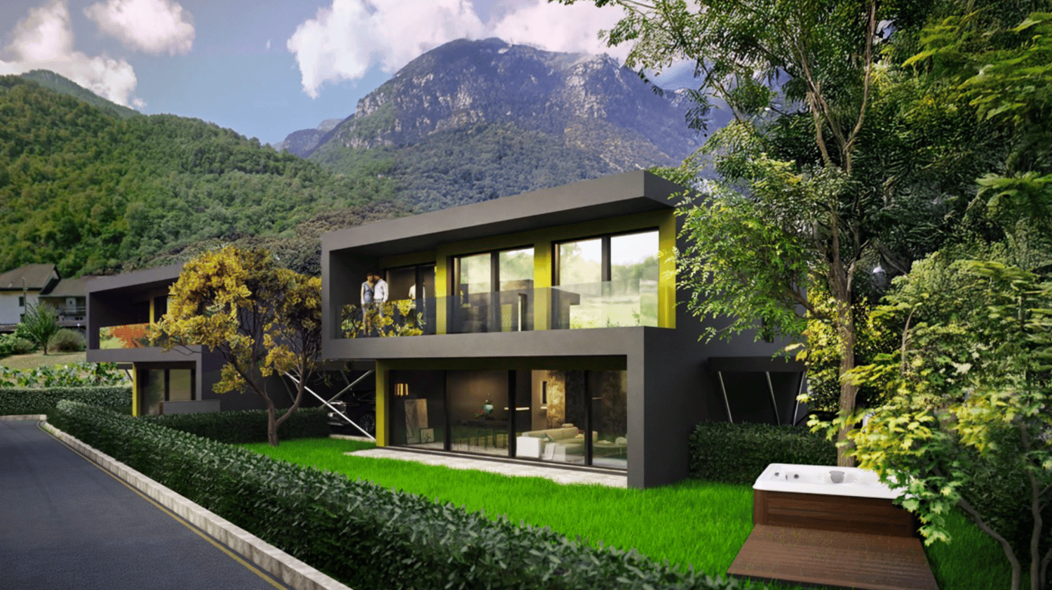 Modern two-story house with large windows, black exterior, surrounded by lush greenery and mountains in the background. The house has a balcony or terrace overlooking the scenic landscape.