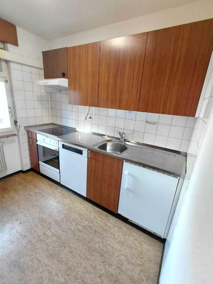 kitchen, stainless steel countertop, sink, dishwasher, oven, wooden cabinets, tiled walls