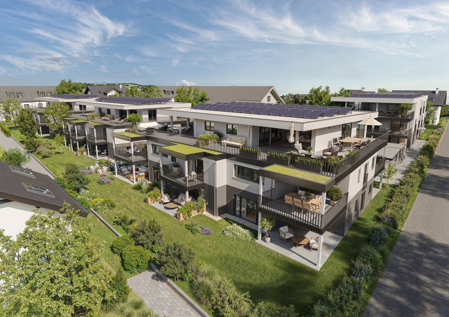 Multi-story apartment building with balconies, solar panels on the roof, and landscaped gardens and walkways around the property.