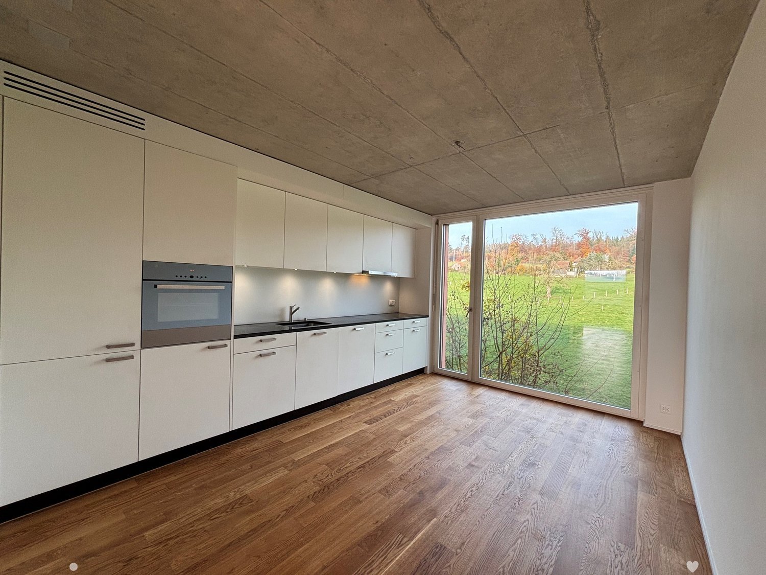 white cabinets, modern kitchen, large window, wooden floor