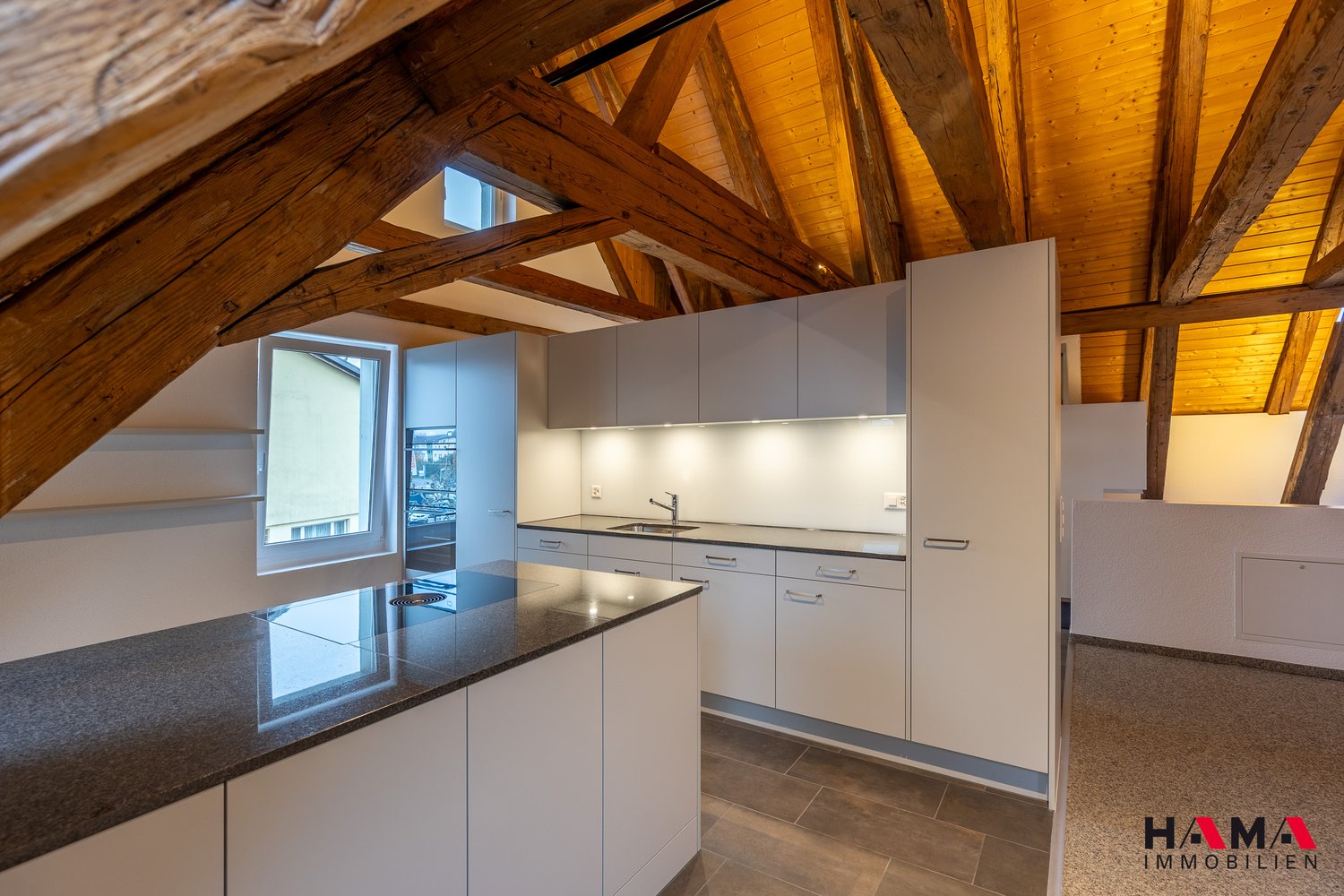 Kitchen, wooden ceiling, black granite countertop, stainless steel sink, modern cabinets, glass door, large window