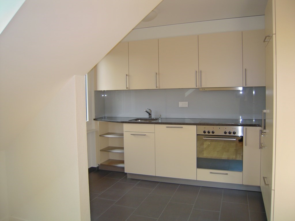 tiled floor, white cabinets, open shelves, silver appliances, sink, faucet, power outlet, mirror, stove, oven