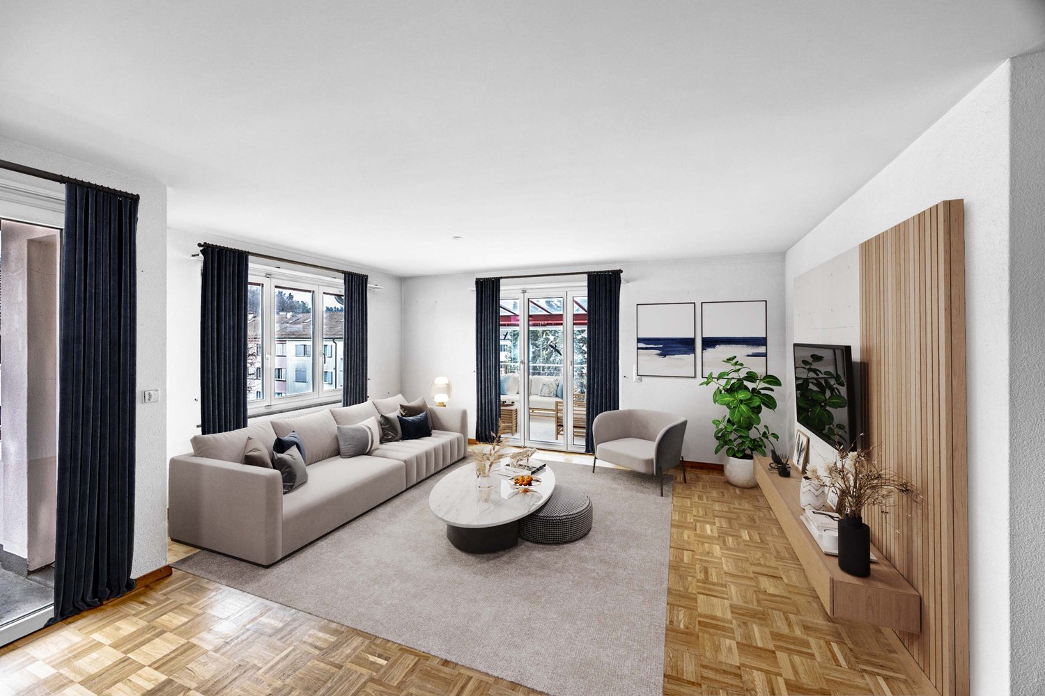 modern living room with gray couch, coffee table, armchair, TV, wooden floor, sliding glass doors to balcony