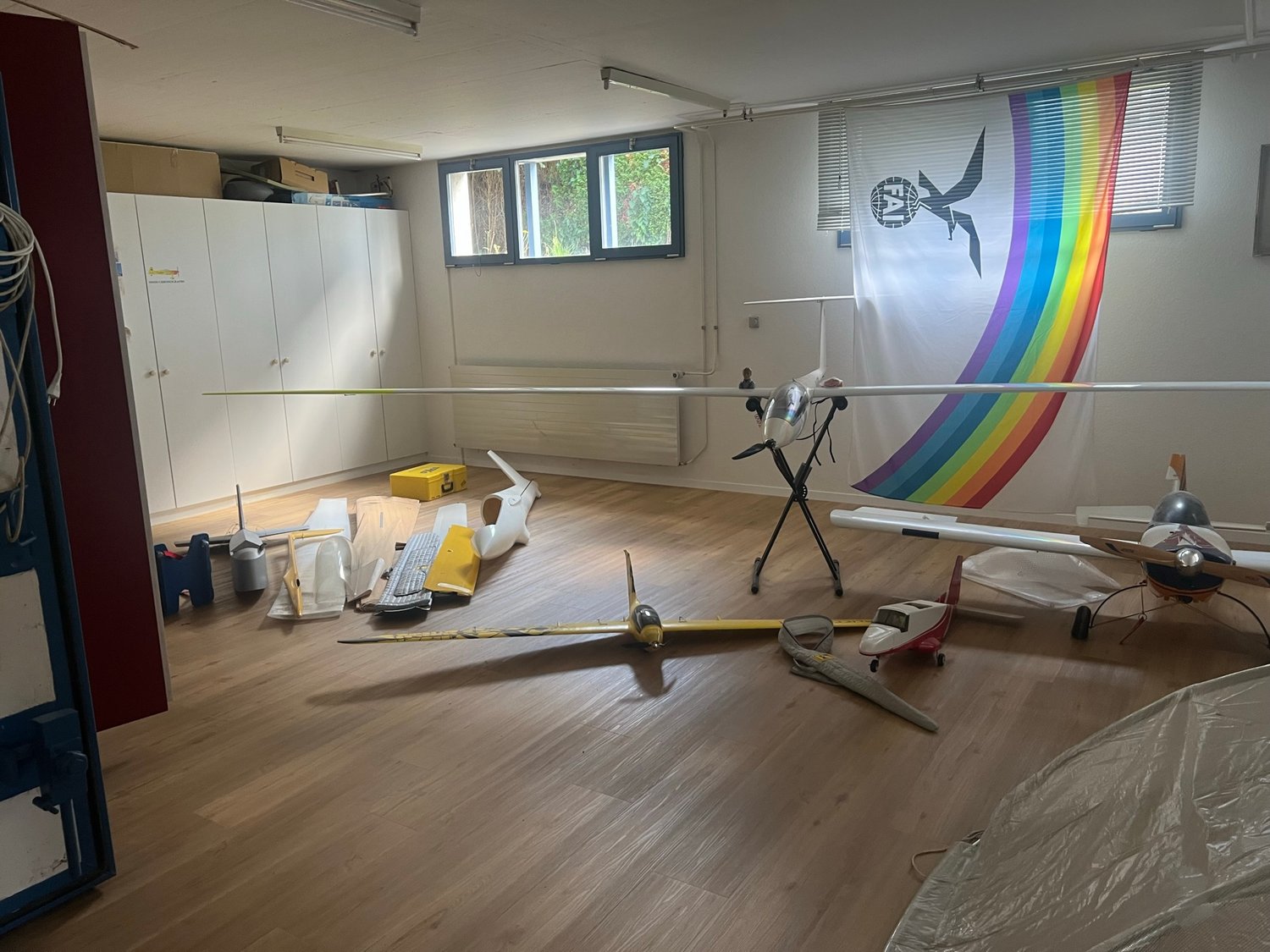 Wooden floor, aircrafts, boxes, cabinets, windows