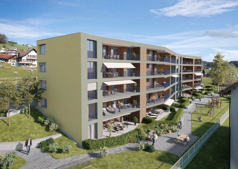 5 story building, yellow, many balconies, green lawn