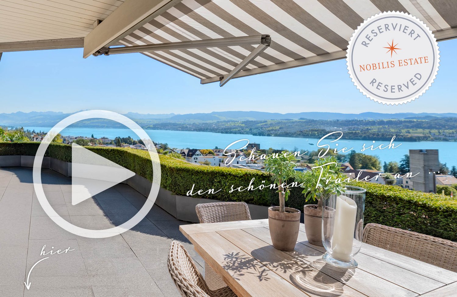 Outdoor wooden table and chairs, table vase, bushes, canopy awning, overlooking mountains and lake